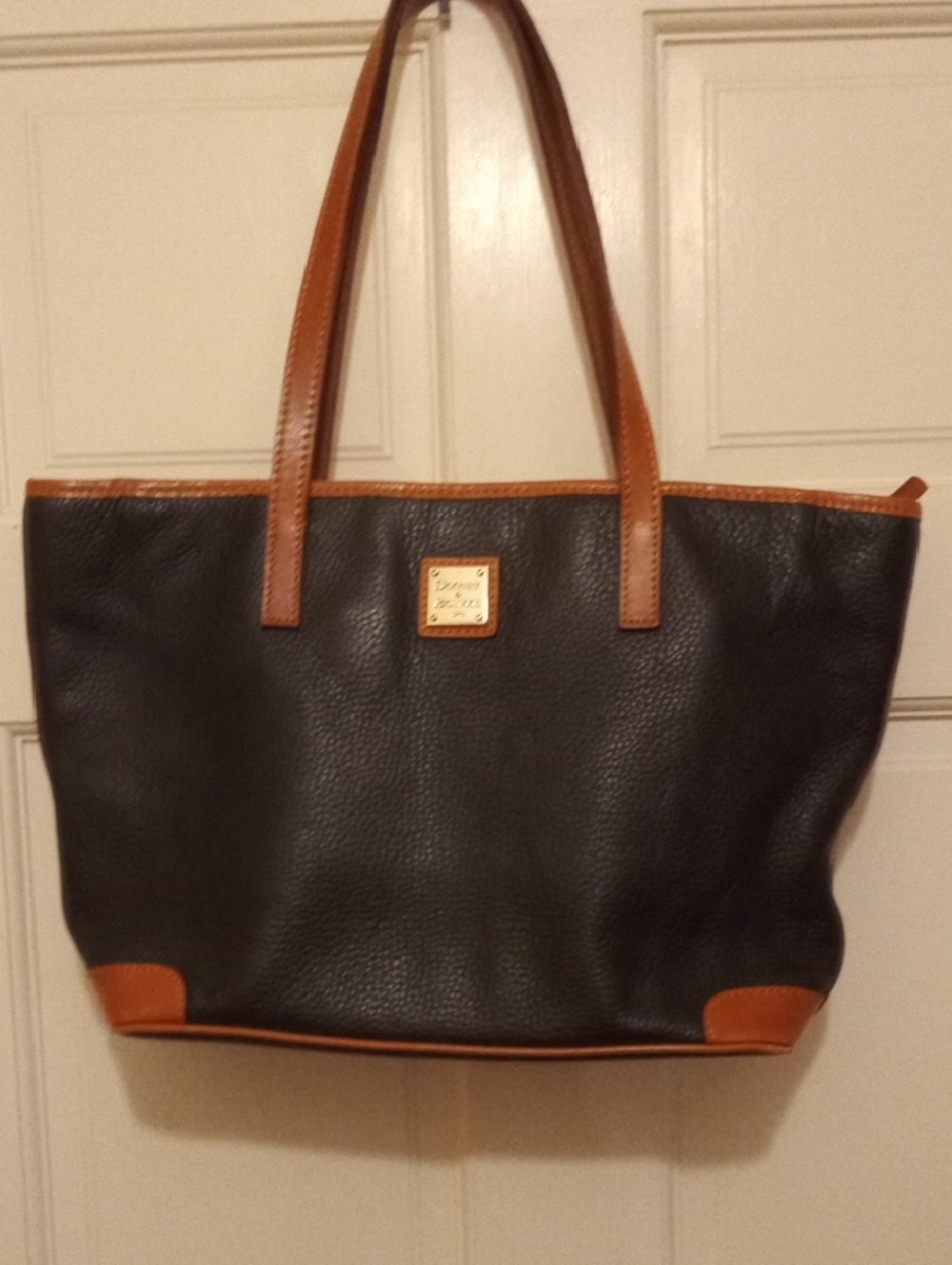Dooney & Bourke Black Pebbled Leather Tote with Brown Trim and Handles